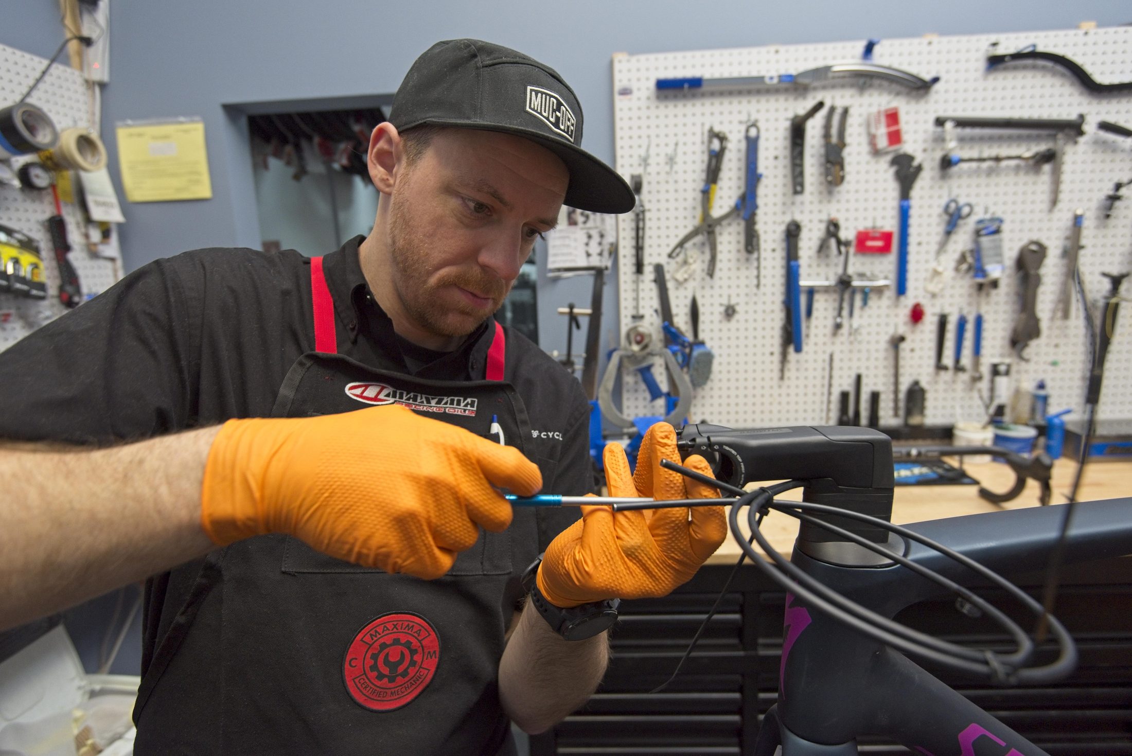Bike mechanic working on a repair in the shop