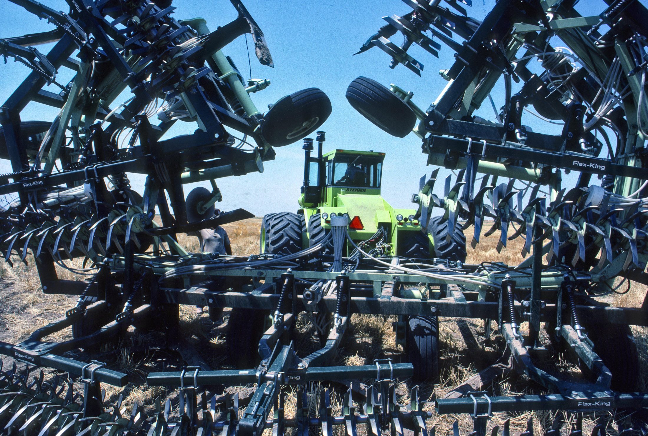 Farm tillage equipment in a field