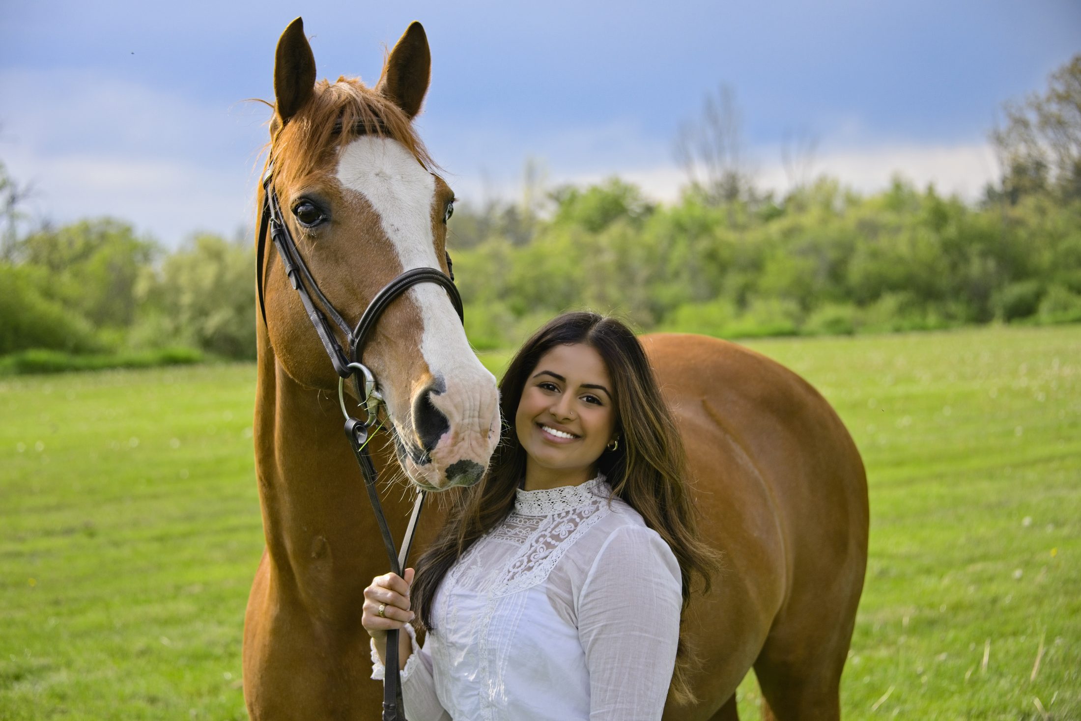 Cornell Equestrian team rider with a chestnut horse, portrait
