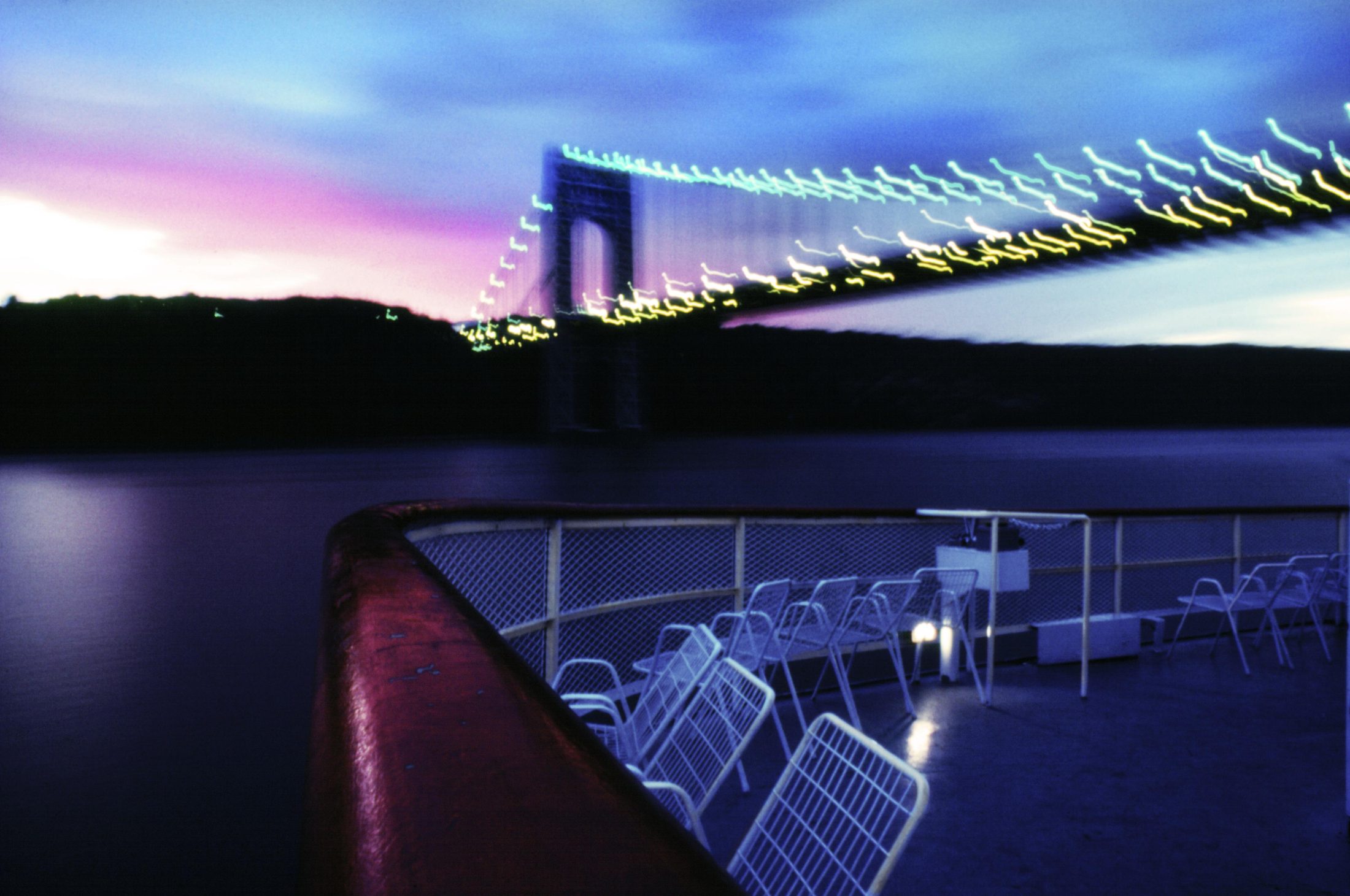 George Washington Bridge at night from a passing ship