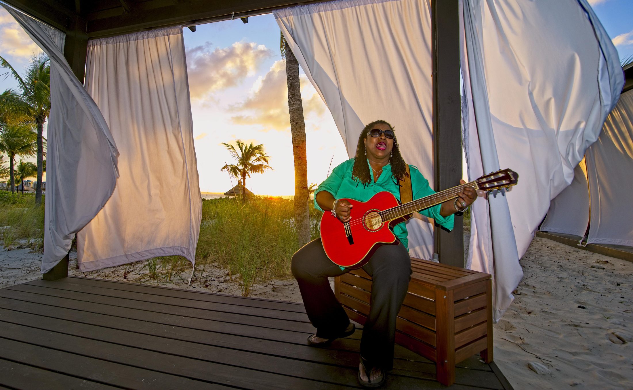 Musician playing guitar at sunset, Turks and Caicos